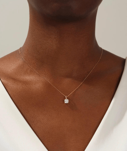 1/2 carat cushion cut diamond necklace on model's neck