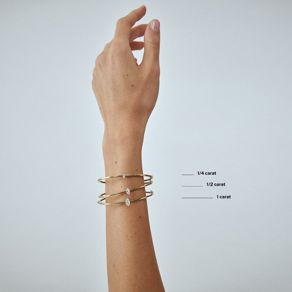 compare marquise diamond carat weight bracelets on model's wrist arm