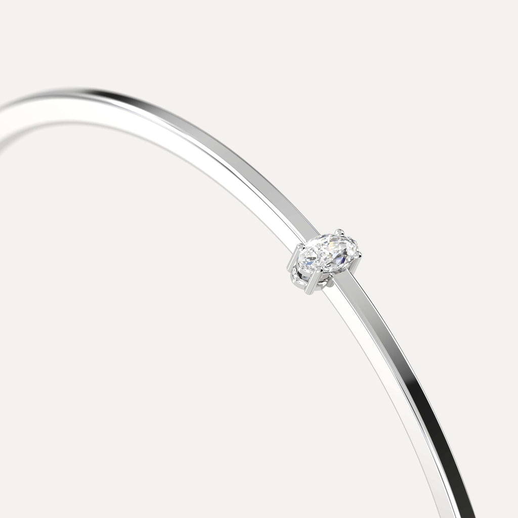 classic diamond solitaire, bangle bracelet with oval natural diamonds in white gold