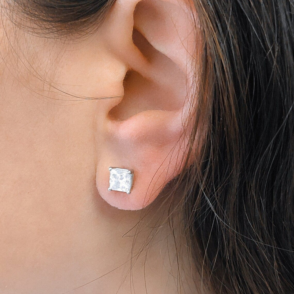 1 carat princess cut diamond earrings on ear