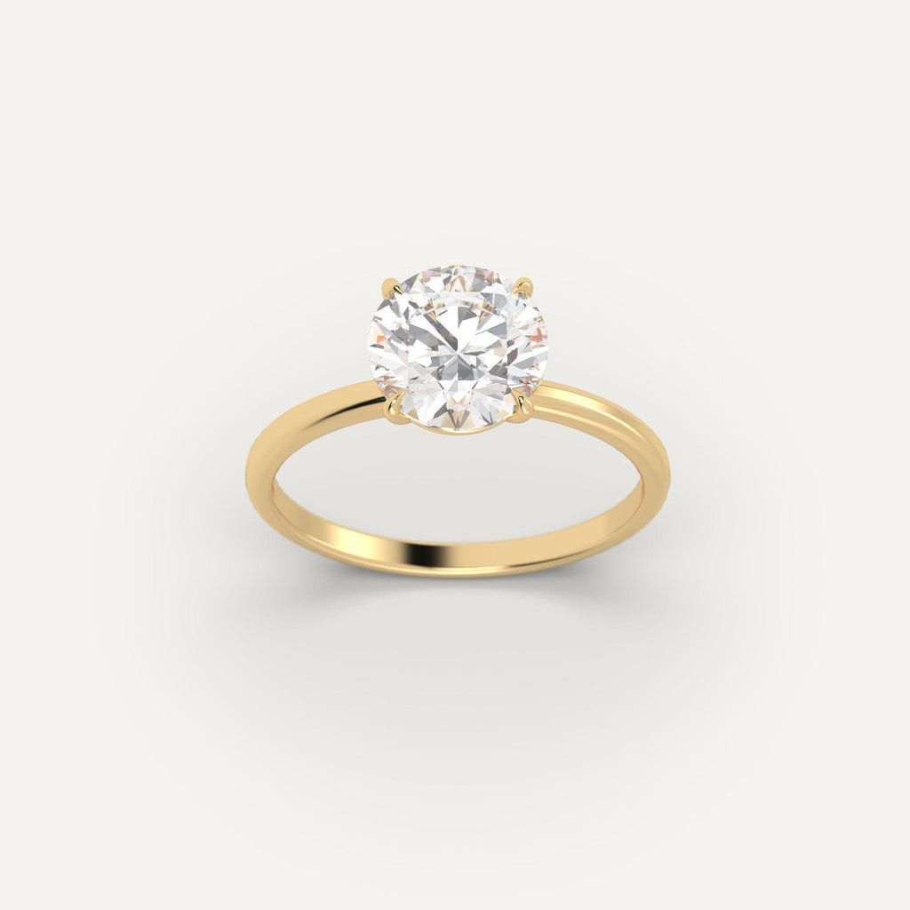 Yellow Gold 2 Carat Engagement Ring On Woman's Hand