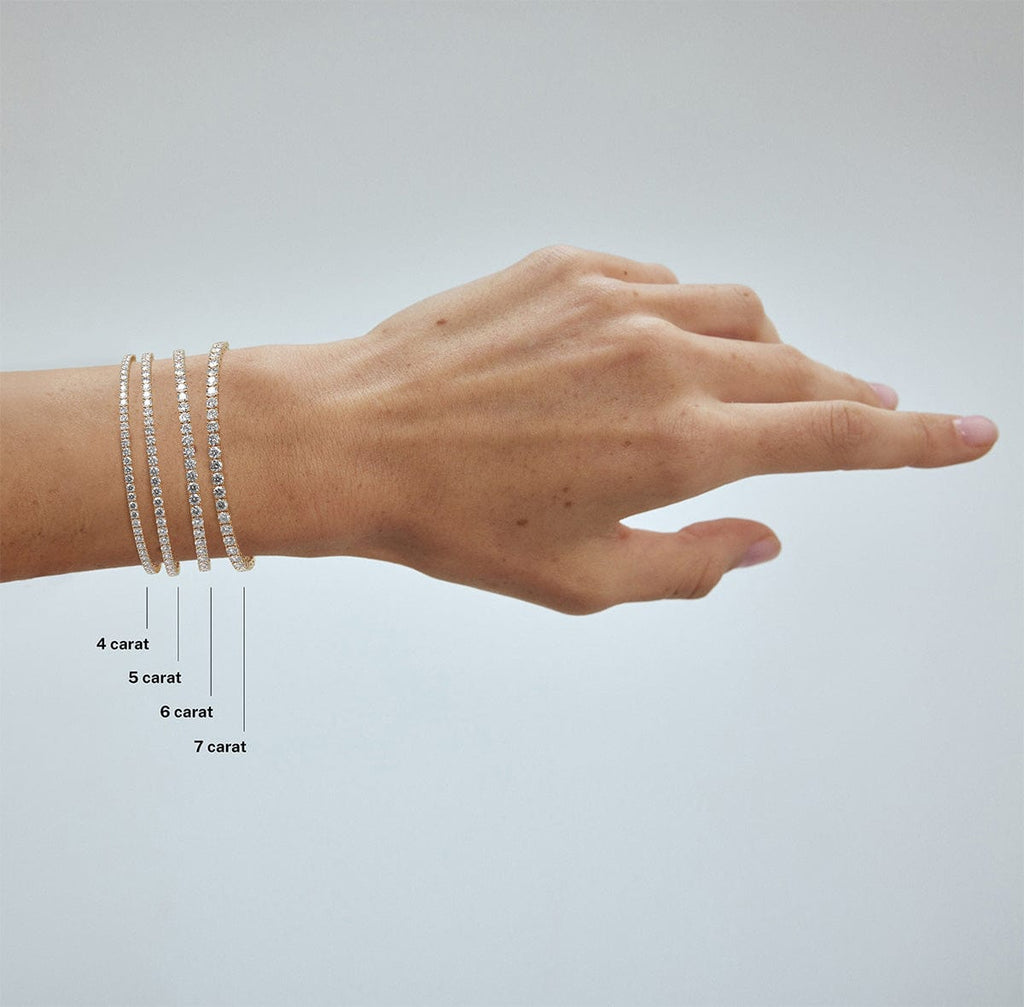 compare 4 carat, 5 carat, 6 carat and 7 carat diamond tennis bracelets on model's wrist arm